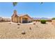 Expansive backyard with desert landscaping and an inviting outdoor seating area at 1204 Golf Club, Laughlin, NV 89029