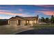 Beautiful one-story home has a three-car garage with well-maintained desert landscaping at 1204 Golf Club, Laughlin, NV 89029