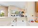 Close up on kitchen sink with ample countertop space and a view out to the backyard patio at 1204 Golf Club, Laughlin, NV 89029