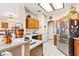 Bright, open kitchen with wood cabinets, stainless steel appliances, and a breakfast bar area at 1204 Golf Club, Laughlin, NV 89029
