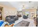 Open-concept living room featuring neutral walls, plush seating, and seamless access to the patio at 1204 Golf Club, Laughlin, NV 89029