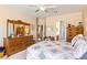 Spacious main bedroom with ample furniture and mirror with an ensuite bathroom entry for added convenience at 1204 Golf Club, Laughlin, NV 89029