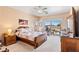 Cozy main bedroom features a large window, dresser, and neutral tones for a relaxing atmosphere at 1204 Golf Club, Laughlin, NV 89029