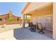 Cozy patio with desert landscaping, a stucco wall, and outdoor seating at 1204 Golf Club, Laughlin, NV 89029