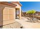 Charming patio with outdoor seating, a stucco wall, and desert-style landscaping at 1204 Golf Club, Laughlin, NV 89029