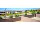 View from backyard of lush landscape, houses, and mountain views at 12101 Arrebol Ave, Las Vegas, NV 89138