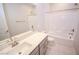 Bathroom featuring a tub, shower, sink, and toilet with neutral tones at 12101 Arrebol Ave, Las Vegas, NV 89138