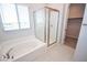 Bathroom showcasing a soaking tub, glass shower, and modern fixtures at 12101 Arrebol Ave, Las Vegas, NV 89138