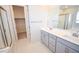 Bathroom featuring a glass shower, and double vanity with modern fixtures at 12101 Arrebol Ave, Las Vegas, NV 89138