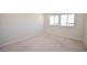 Bright bedroom featuring plush carpeting and two windows offering plenty of natural light at 12101 Arrebol Ave, Las Vegas, NV 89138
