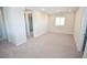 Large bonus room with neutral carpet and natural light, offers many possibilities at 12101 Arrebol Ave, Las Vegas, NV 89138
