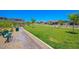 Beautiful community park featuring green spaces, walking paths, and seating areas at 12101 Arrebol Ave, Las Vegas, NV 89138