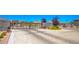 Gated community entrance with well-maintained landscaping, ensuring privacy and security for residents at 12101 Arrebol Ave, Las Vegas, NV 89138
