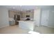 Bright kitchen with ample storage, a center island, and stainless steel appliances at 12101 Arrebol Ave, Las Vegas, NV 89138