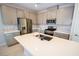 Spacious kitchen featuring a center island with seating and modern appliances at 12101 Arrebol Ave, Las Vegas, NV 89138