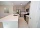 Well-equipped kitchen with gray cabinets, white countertops, and stainless steel appliances at 12101 Arrebol Ave, Las Vegas, NV 89138