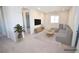 Virtual staged living room with sectional sofa, TV, and decorative plant, perfect for entertaining at 12101 Arrebol Ave, Las Vegas, NV 89138