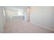 This open loft space features neutral walls and carpet, along with natural lighting at 12101 Arrebol Ave, Las Vegas, NV 89138