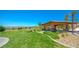 Beautiful park area with a covered picnic structure, lush greenery, and scenic views, perfect for community gatherings at 12101 Arrebol Ave, Las Vegas, NV 89138