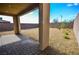 The covered patio has stone pavers overlooking the low maintenance backyard at 12101 Arrebol Ave, Las Vegas, NV 89138