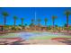 A large net climbing structure surrounded by lush landscaping and shade structures offers fun and recreation for families at 12101 Arrebol Ave, Las Vegas, NV 89138