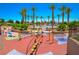 A colorful playground provides a fun and safe area for to play and socialize outdoors at 12101 Arrebol Ave, Las Vegas, NV 89138