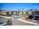 A street view of modern homes with desert landscaping and mountain views at 12101 Arrebol Ave, Las Vegas, NV 89138