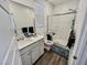 Clean bathroom with a glass-enclosed shower, white cabinets, and modern fixtures at 1288 Ventura Cliffs Ave, Henderson, NV 89012
