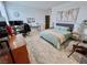 Bedroom with a large bed and desk at 1288 Ventura Cliffs Ave, Henderson, NV 89012