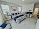 Bright bedroom features a bed, workspace with monitors, and decor at 1288 Ventura Cliffs Ave, Henderson, NV 89012