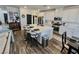 Bright kitchen with white cabinetry, stainless steel appliances, and an island with seating at 1288 Ventura Cliffs Ave, Henderson, NV 89012