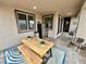 Stylish covered patio with rustic table, seating, and mini fridge perfect for relaxing or entertaining at 1288 Ventura Cliffs Ave, Henderson, NV 89012