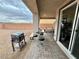 Covered patio featuring a BBQ grill, seating, and sliding glass doors that create an open-air feel at 1288 Ventura Cliffs Ave, Henderson, NV 89012