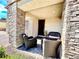 Cozy front porch featuring stone columns and outdoor seating, perfect for relaxing or welcoming guests at 1288 Ventura Cliffs Ave, Henderson, NV 89012