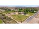 The house has a circular driveway, a lawn, and fields where livestock grazes at 1470 St Joseph St, Overton, NV 89040