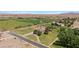 The aerial view captures the expansive property with the house and farm fields at 1470 St Joseph St, Overton, NV 89040