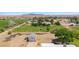 Expansive ranch property featuring green pastures, mature trees, and a charming single-story house at 1470 St Joseph St, Overton, NV 89040