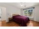 Comfortable bedroom with natural light, a ceiling fan, and hardwood floors at 1470 St Joseph St, Overton, NV 89040