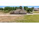Rear view of the home and its large covered patio with a table and chairs at 1470 St Joseph St, Overton, NV 89040
