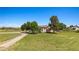 Charming single-story home with a well-manicured lawn and mature trees on a sunny day at 1470 St Joseph St, Overton, NV 89040