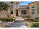 Welcoming front door with a wreath and decorative landscaping, inviting you into your next home at 1470 St Joseph St, Overton, NV 89040