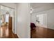 View of hallway featuring hardwood floors, bedroom, and adjacent room at 1470 St Joseph St, Overton, NV 89040