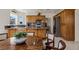 Open concept kitchen with wooden cabinets, granite countertops, and tile flooring at 1470 St Joseph St, Overton, NV 89040