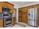 View of kitchen featuring stainless steel appliances, oak cabinets, and granite countertops at 1470 St Joseph St, Overton, NV 89040