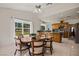 Eat-in kitchen features wooden cabinetry, tile flooring, and stainless steel appliances at 1470 St Joseph St, Overton, NV 89040