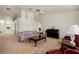 Bright living room featuring carpet, piano, and vaulted ceiling with fan at 1470 St Joseph St, Overton, NV 89040