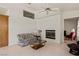 Cozy living room with fireplace, tile flooring, and comfortable seating arrangement at 1470 St Joseph St, Overton, NV 89040