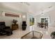 Bright living area with tile flooring, neutral color scheme, and views of the backyard at 1470 St Joseph St, Overton, NV 89040