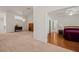 Spacious living room with neutral carpet, chandelier, and open view into the bedroom and bathroom at 1470 St Joseph St, Overton, NV 89040