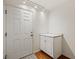 Mud room with white cabinets, a granite countertop, and a white front door at 1470 St Joseph St, Overton, NV 89040